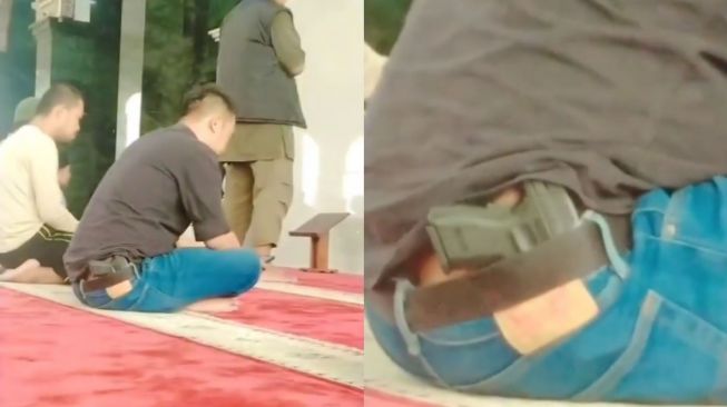 Viral Pria Berpistol Shalat di Masjid, Ini Faktanya!