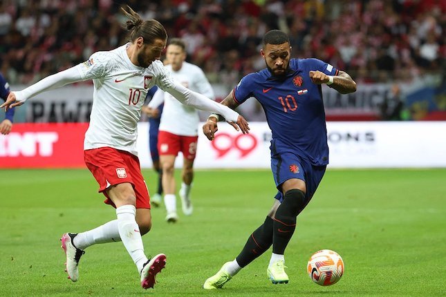 
 Memphis Depay saat berlaga di pertandingan Polandia vs Belanda dalam lanjutan UEFA Nations League 2022/2023. (AP Photo/Bola.net/Bogordaily.net)